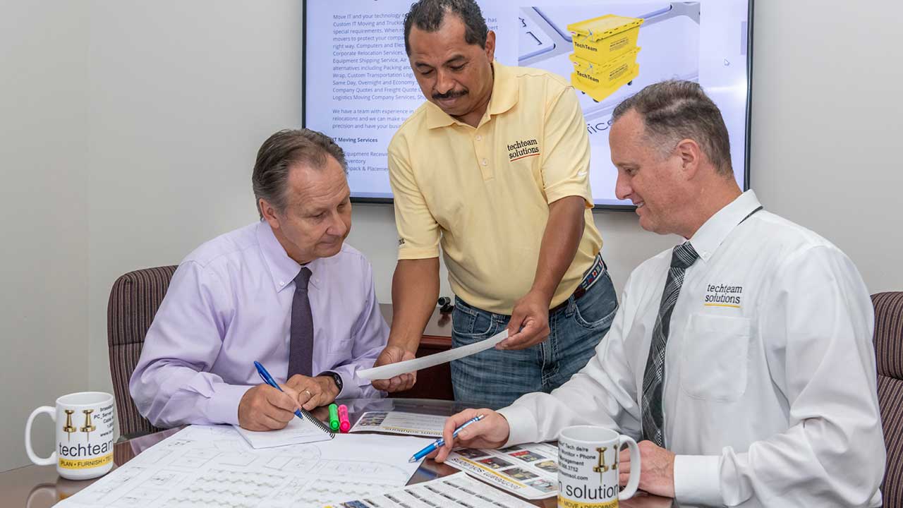 Image of tech team solutions team planning a move. IT mover vs office mover Dallas